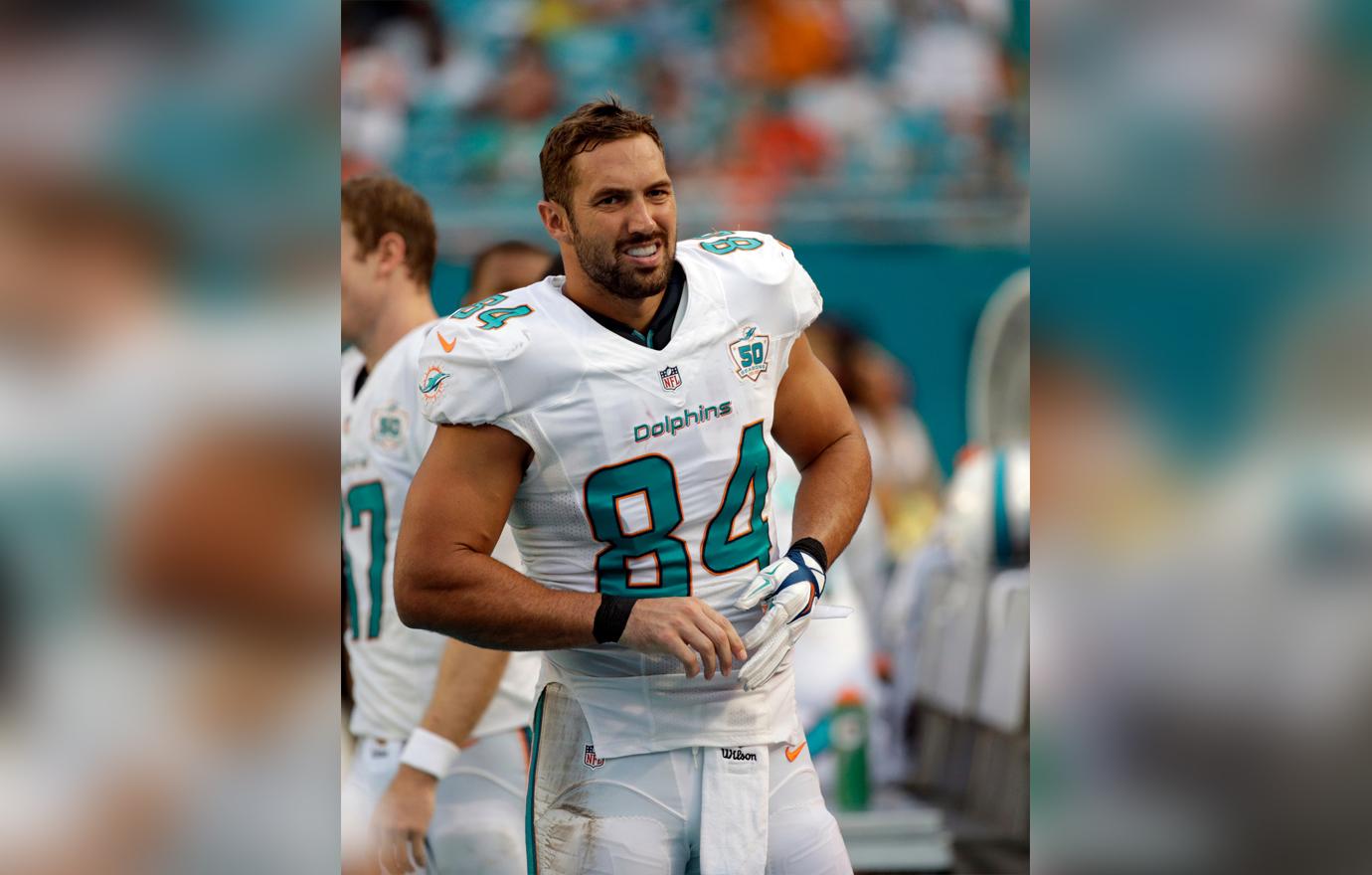 Jordan Cameron Smiling in White Miami Dolphins Uniform In The Middle of A Game