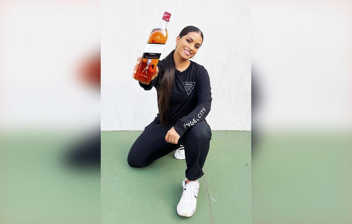 lilly singh toasts to angel city fcs new crest with custom engraved bottle of jane walker by johnnie walker