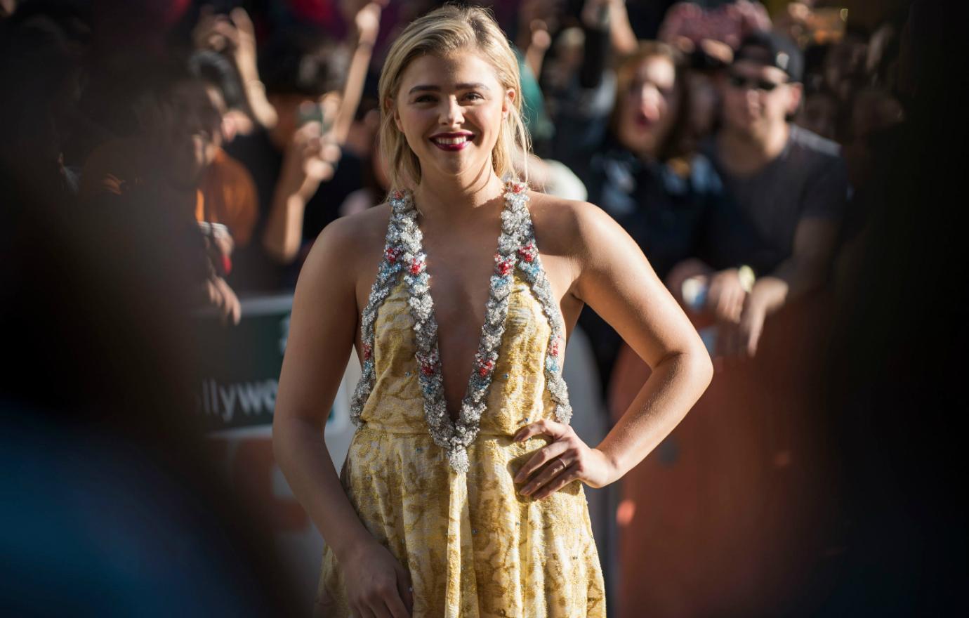 Chloe Grace Moretz on the red carpet in a Miu Miu dress.