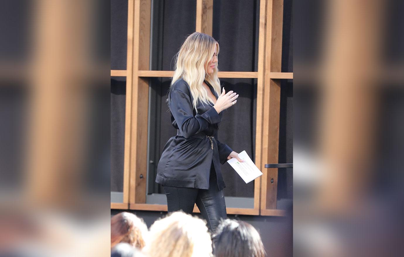 Pregnant Khloe Kardashian Covers Baby Bump During Promotional Appearance