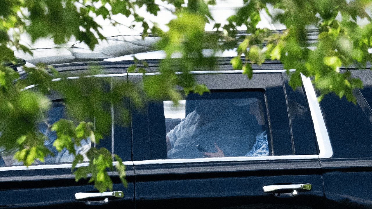 The president and his young personal aide were spotted getting comfy in the back seat of a car.