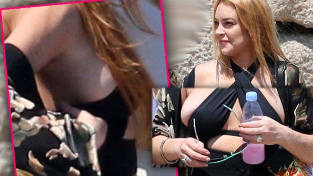 Lindsay Lohan suffers unfortunate nipple slip in plunging blue