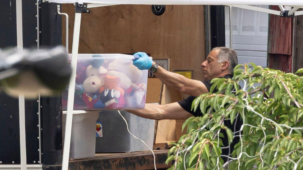 Photo of officers searching Rex Heuermann house.