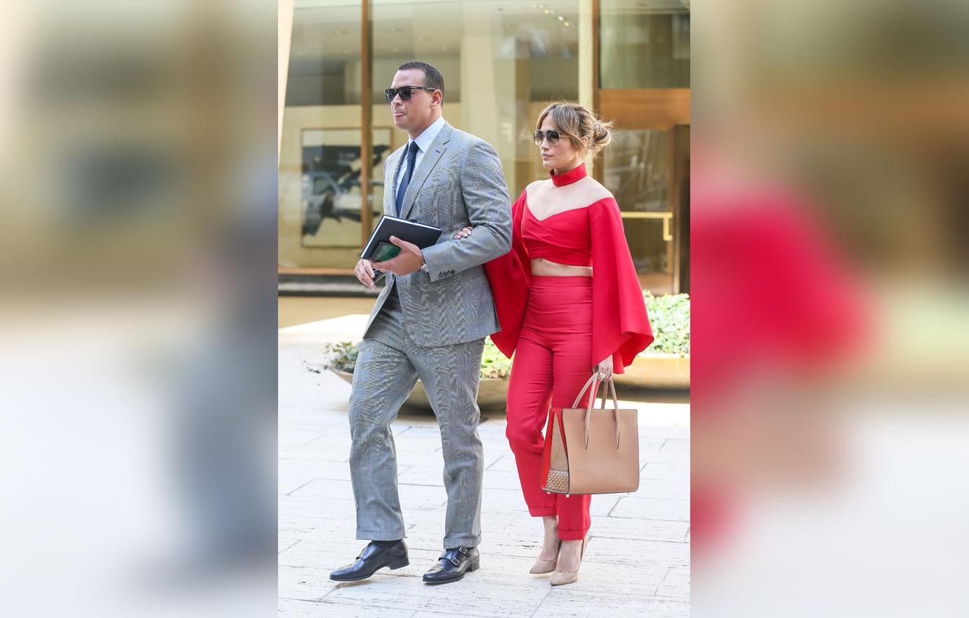 //jennifer lopez alex rodriguez holding arms red shirt boobs pants