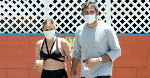 Photo of Gaga and Michael holding hands while on the road.