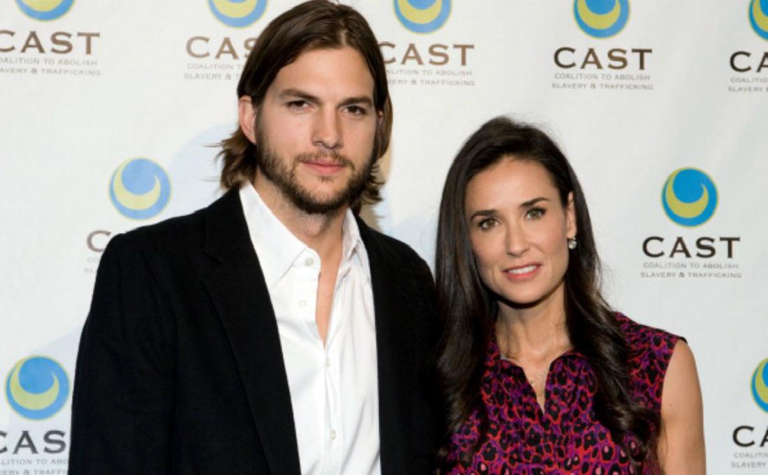 Ashton Kutcher and Demi Moore pose on the red carpet.