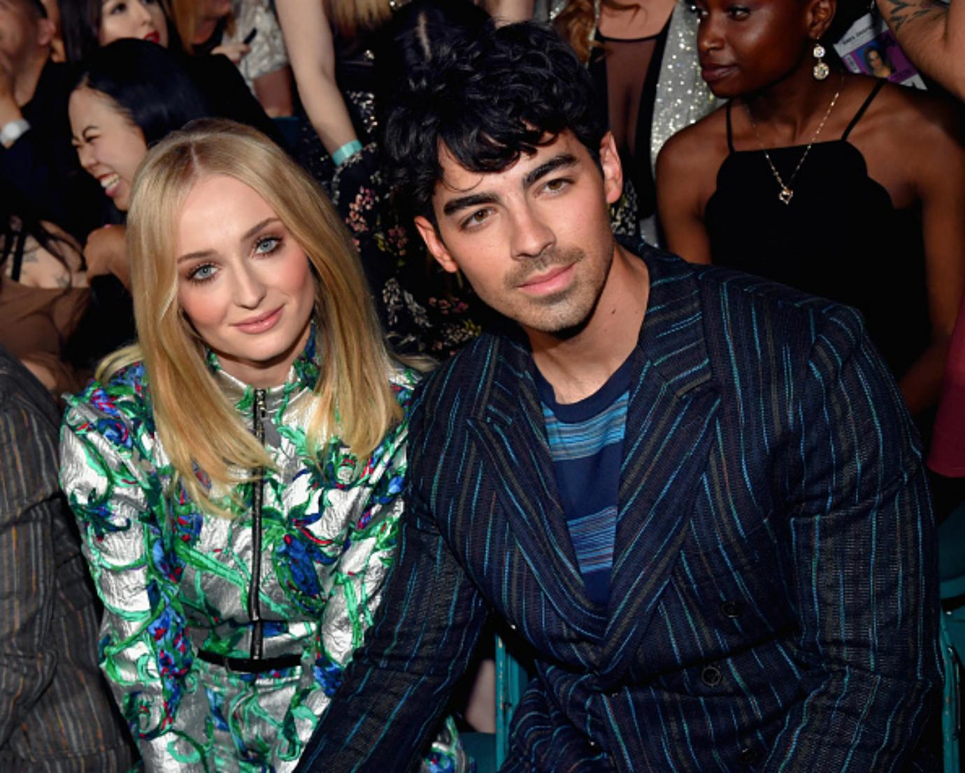 Sophie Turner and Joe Jonas sit at the Billboard Music Awards.