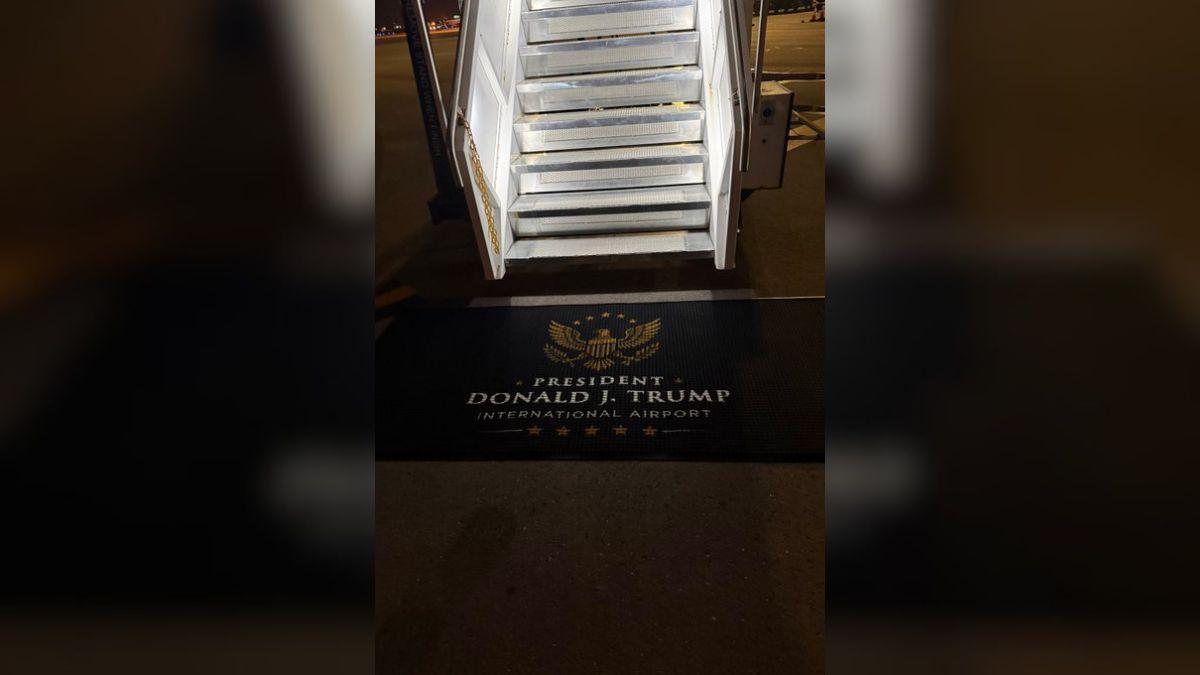 A photo of a doormat outside of an airplane