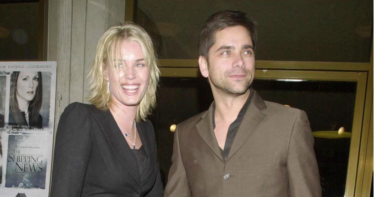 Photo of John Stamos and. Rebecca Romijn