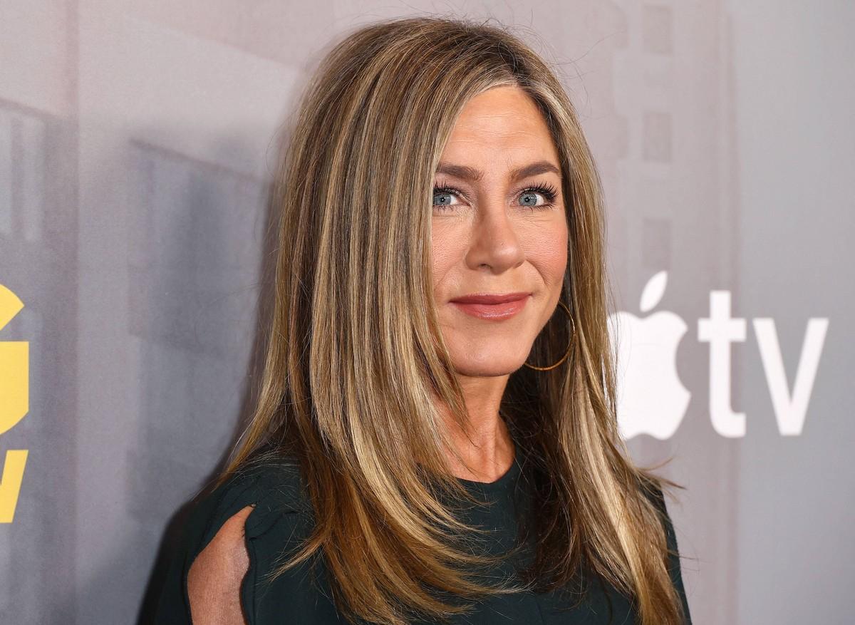 Jennifer Aniston's pals fear Jim Curtis is using her fame to boost his book sales.