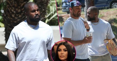 Kanye West carries a bag of fast food from his beloved McDonalds as he heads to a meeting in Calabasas.