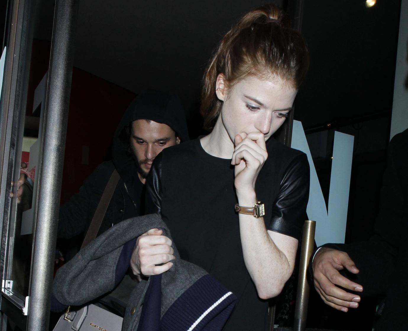 Rose Leslie exits theater in front of Kit Harington