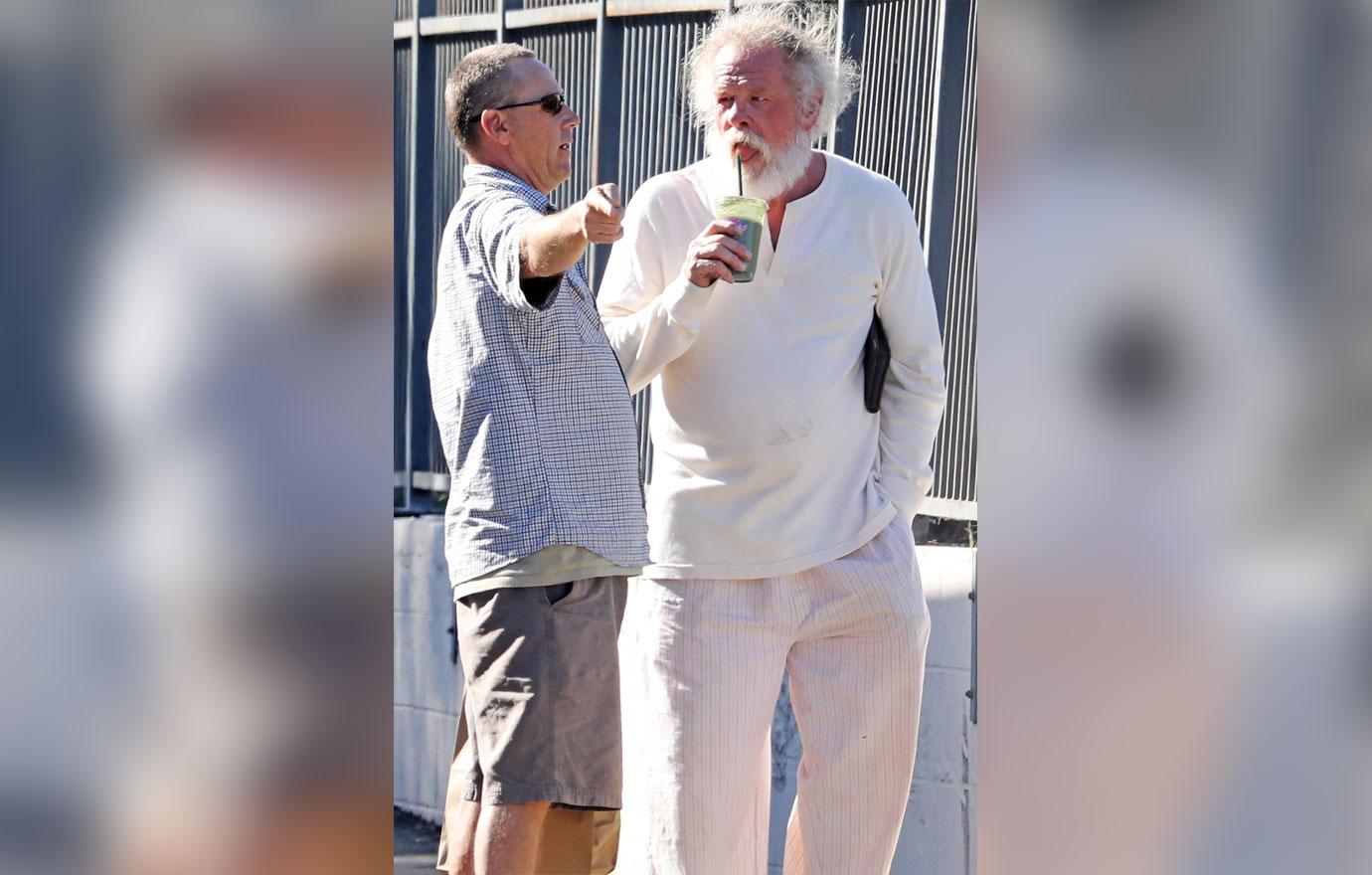 //Nick Nolte Climbs Fence Photos