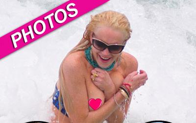 //lindsay lohan loses bikini top _ _