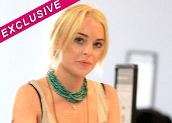 //lindsay lohan lawsuit paparazzo foot