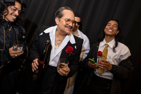 willy chavarria raises a glass with tequila don julio surrounded by his cast and crew in celebration of the debut of his fall winter collection during new york fashion week on february