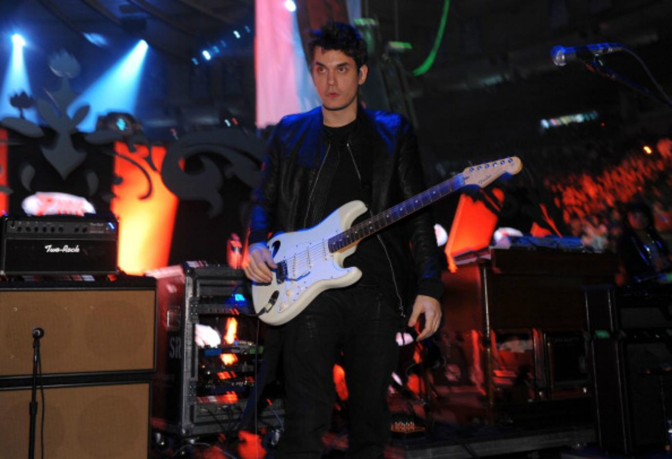 John Mayer performs on stage.