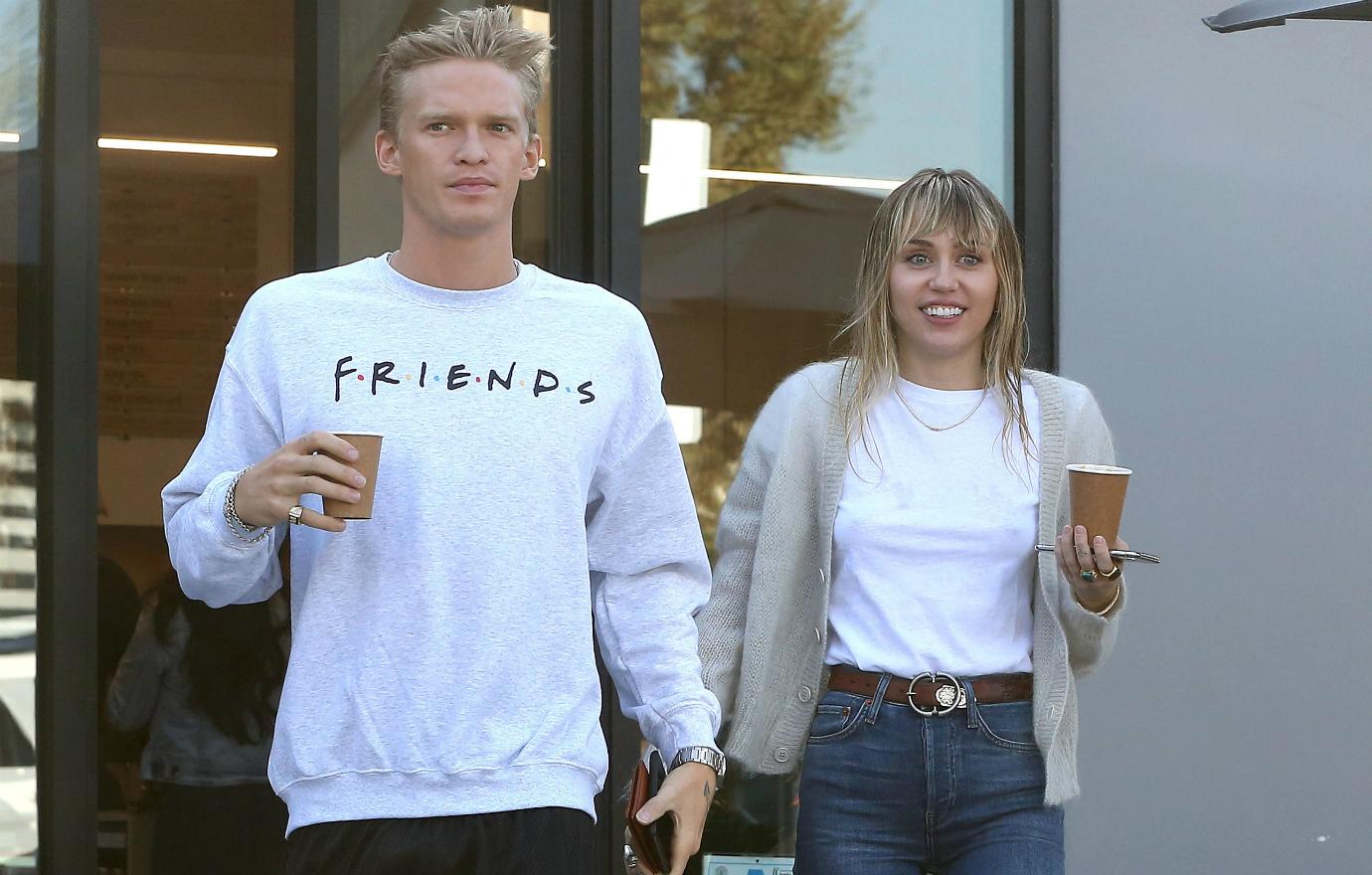 Cody Simpson wore a Friends long-sleeved T-shirt while Miley Cyrus sported blue jeans, a white shirt and a grey sweater.