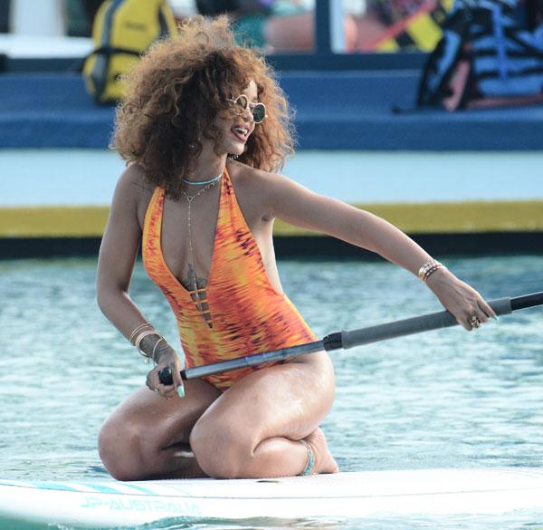 //rihanna swimsuit paddleboarding photos