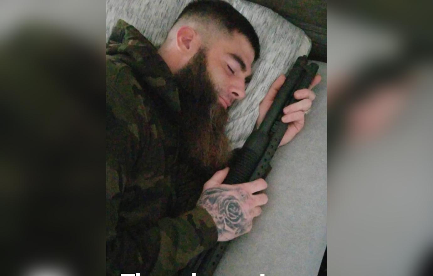 David Eason pretends to be asleep next his gun.