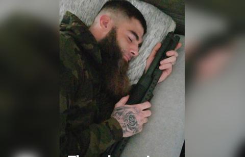 David Eason pretends to be asleep next his gun.