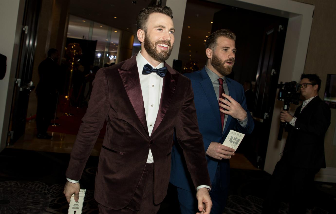 Chris Evans, who wore a velvet maroon jacket with his tux, took brother Scott Evans, who sported a blue suit, to the Golden Globes.