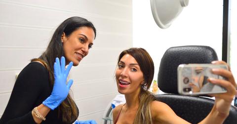 woman taking selfie with doctor