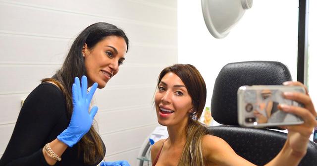 woman taking selfie with doctor