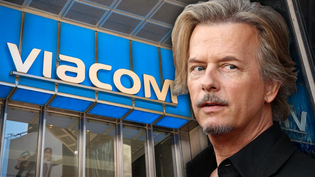 David Spade Looks Worried In Front of Viacom Building Logo Sign Facade