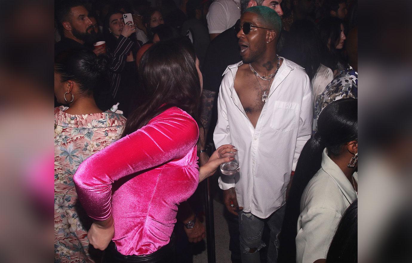 kid cudi shows off nipple ring partying miami meek mill cozy female friend