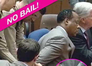 //conrad murray no bail handcuffs npg