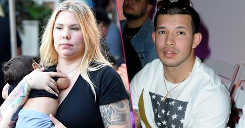 Kailyn Lowry holds on to her kids. Javi looking puzzled while wearing an American flag t-shirt.