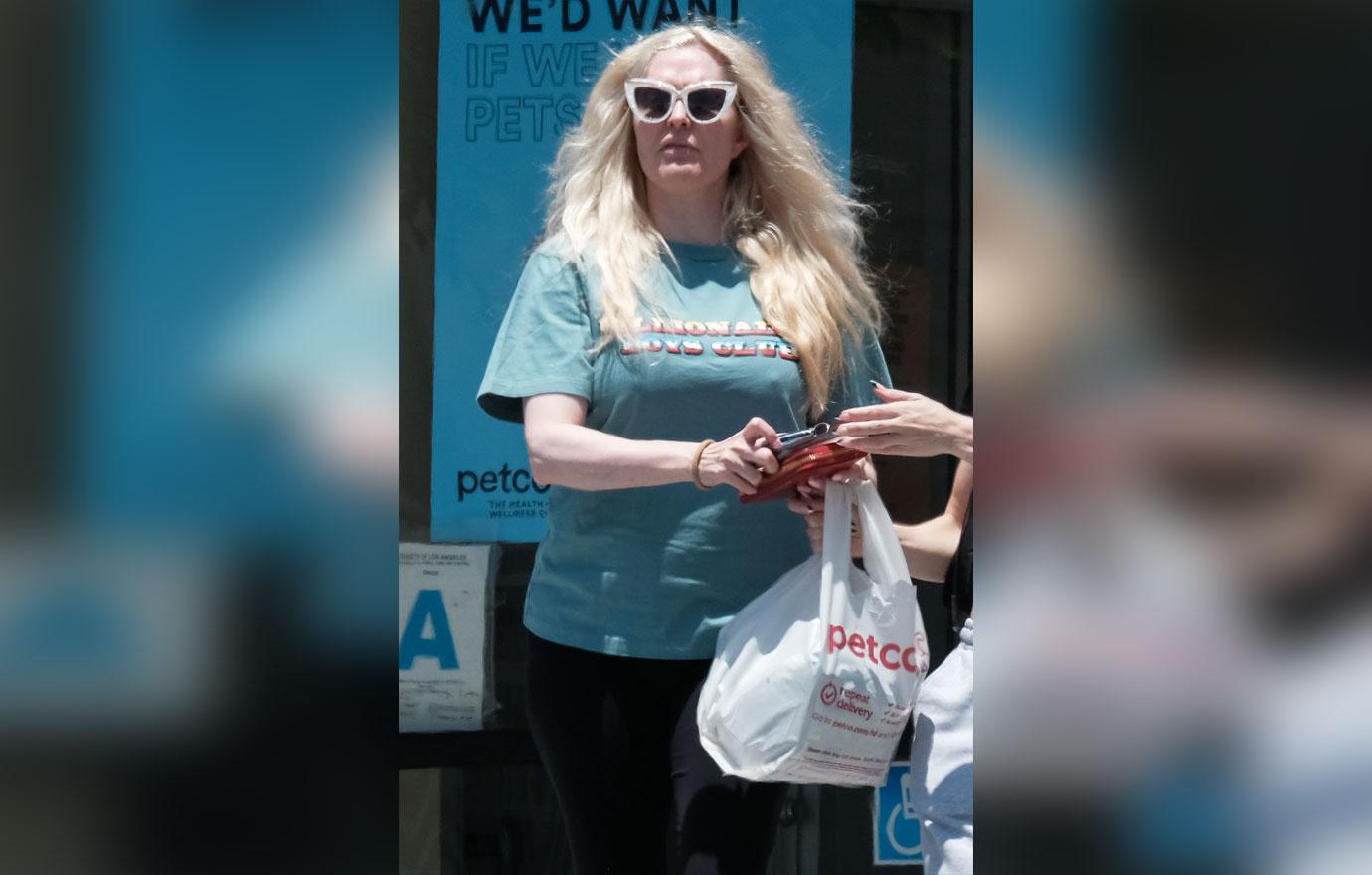 erika jayne photos unrecognizable explosive rhobh dinner holding atm card embezzelement investigation