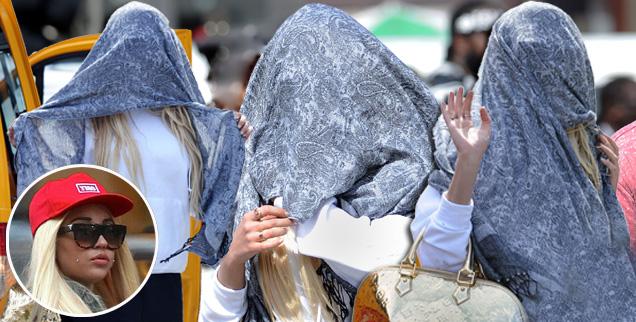 Amanda Bynes walks around New York City with blue scarf covering