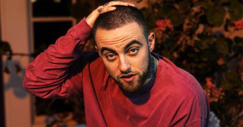 Mac Miller With Hand On His Head Wearing Red Sweatshirt