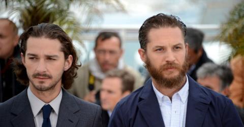 Shia LaBeouf and Tom Hardy walk next to each other.