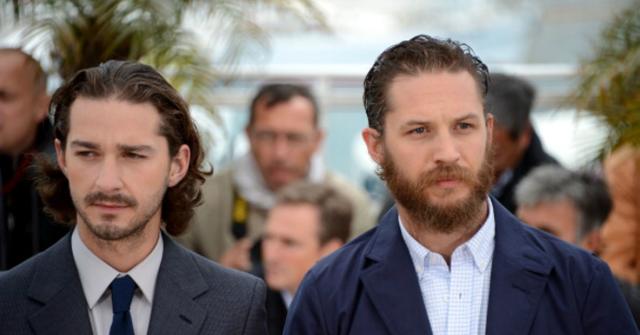 Shia LaBeouf and Tom Hardy walk next to each other.