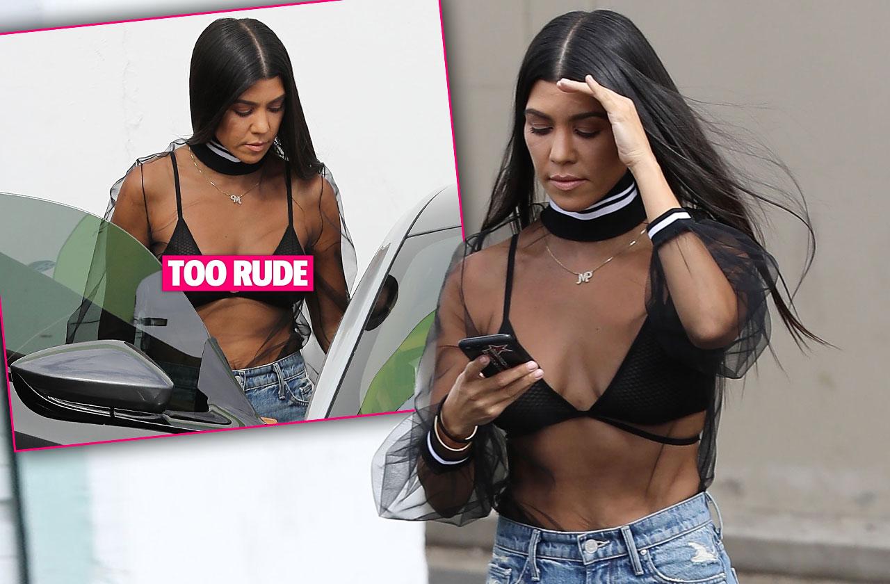 kourtney kardashian shows bra mesh top