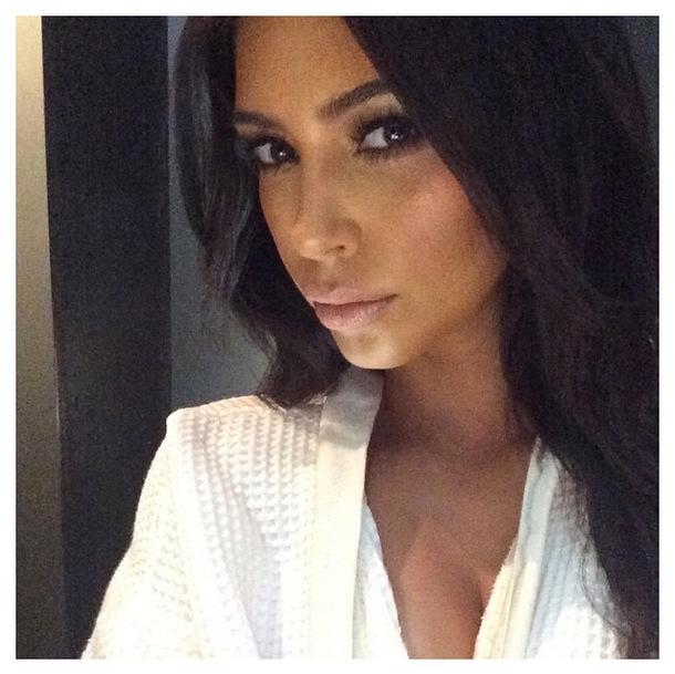 //kim kardashian smiling wrinkles serious pics