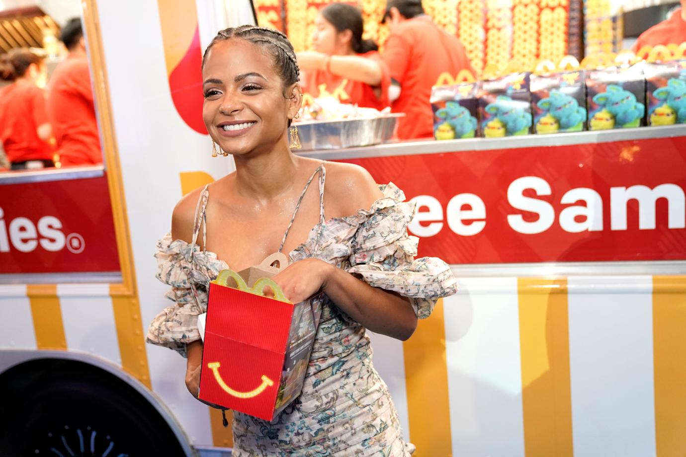 Christina Milian Wearing Dress and Smiling with McDonald's Happy Meal Red Box