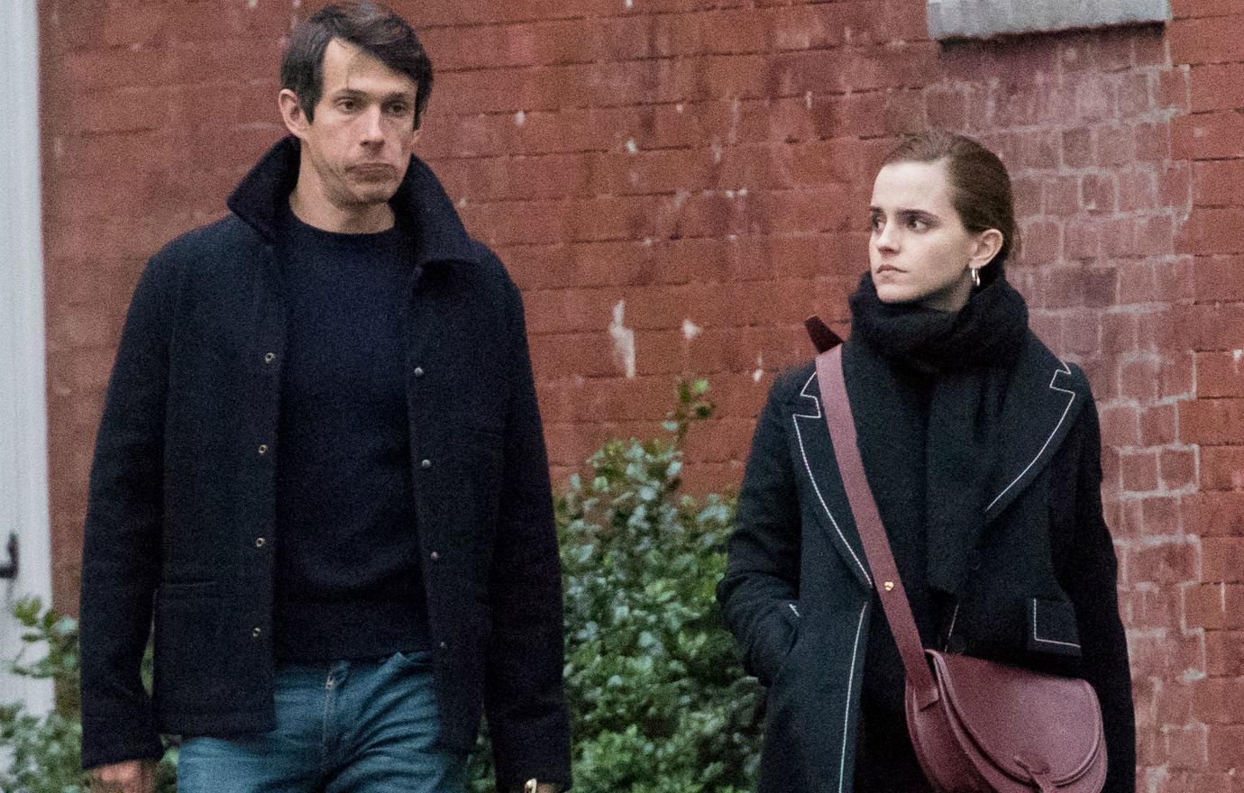 Emma Watson appeared with William Knight wearing matching black winter coats while she wore a matching black scarf.