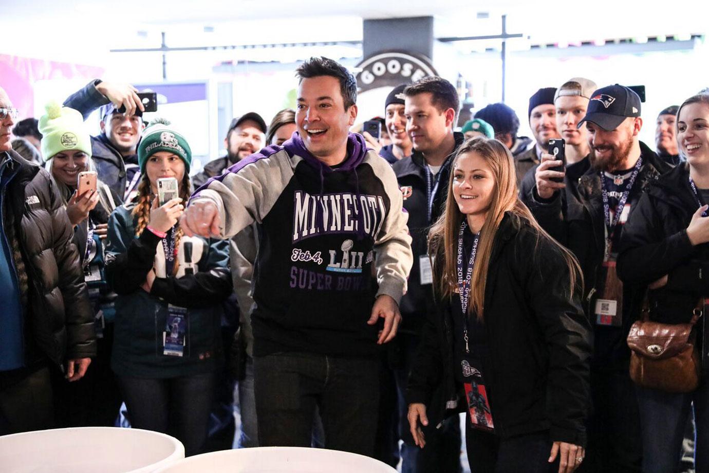 //Jimmy Fallon playing a game of oversized beer pong at StubHub Field House an annual pre game fan event