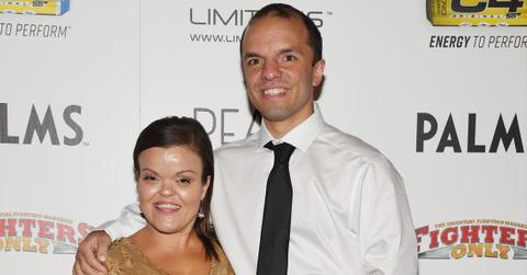 Christy McGinty stands next to Gonzo at the MMA awards.