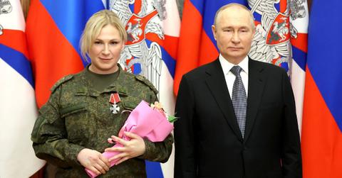 Putin's Mystery Blonde Identified As Russian Army Medic Anna Sidorenko