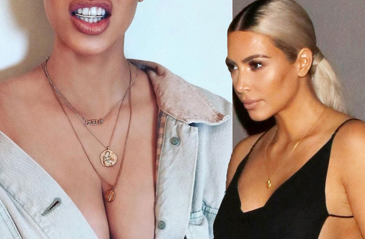 //kim kardashian flaunts diamond grill cleavage pp