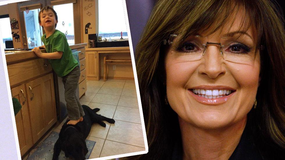 Sarah Palin's Son Standing On Dog