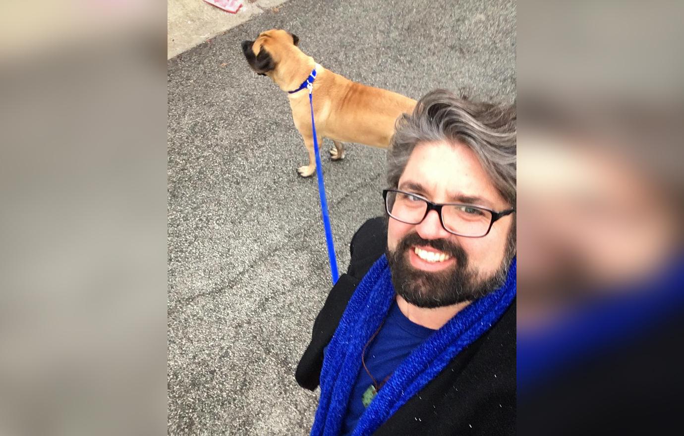 Andrew Glennon Smiles For Selfie While Walking A Dog