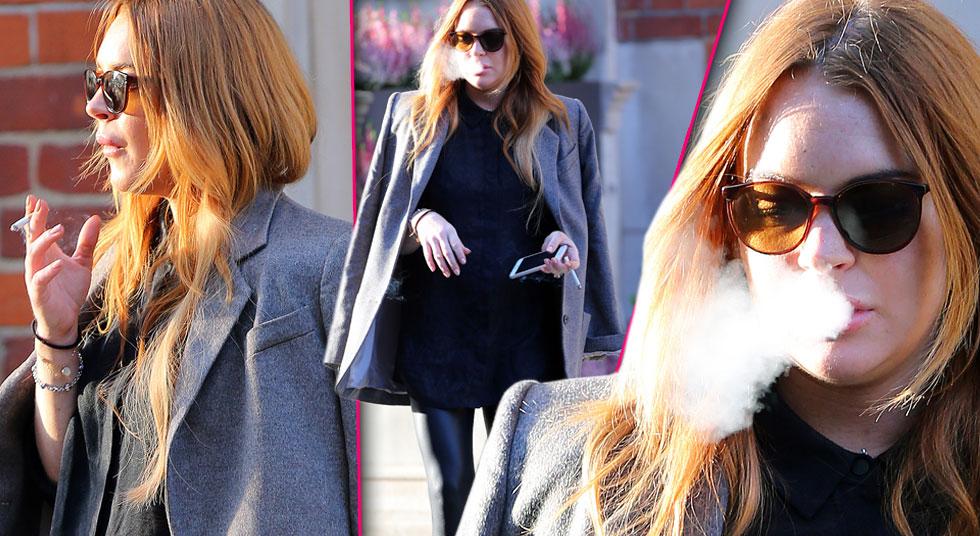 Lindsay Lohan Takes Smoking Break Outside Of London Hotel