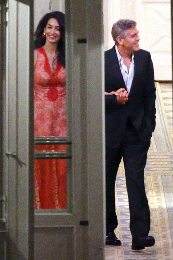 //george clooney amal clooney dinner italy kiss hold hands