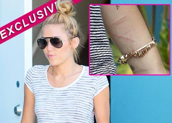 //miley cyrus cutting exclusive